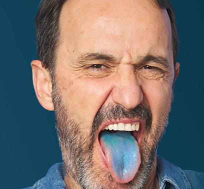 guy sticking out his blue colored tongue